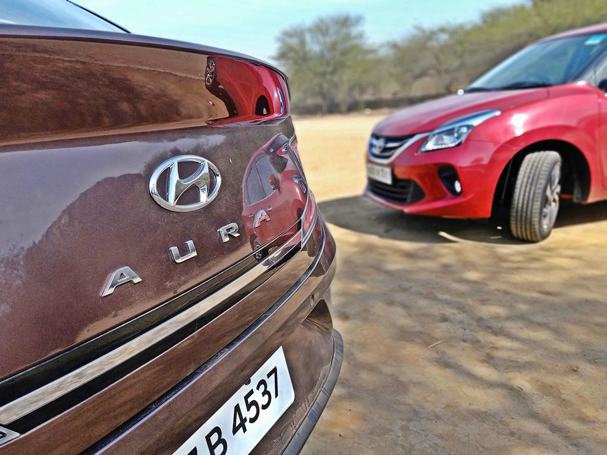 Hyundai Aura Vs Toyota Glanza - Premium Hatch Or Compact Sedan? - GaadiKey