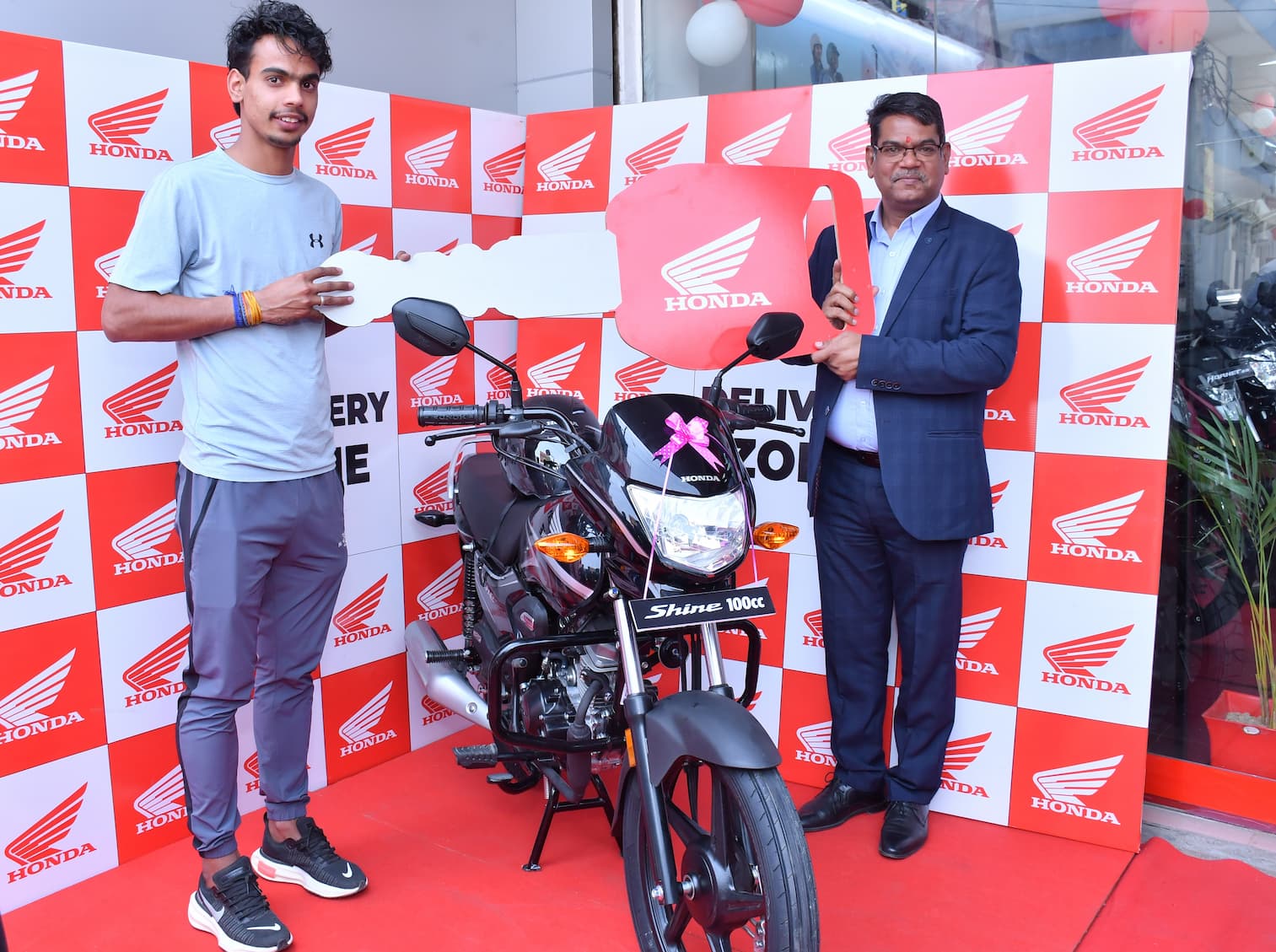 Manesar Half Marathon champion wins Honda Shine 100 - GaadiKey