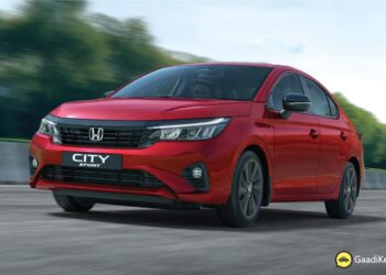 2025 Honda City Sport front view in Radiant Red Metallic with black grille and sporty bumper design