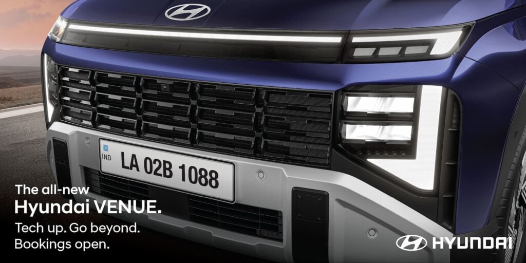 Close-up of the Dark Chrome Radiator Grille and Horizon LED positioning lamp on the all-new 2025 Hyundai Venue ----- New Stylish Grille  - Front view of the all-new 2025 Hyundai Venue in Mystic Sapphire blue