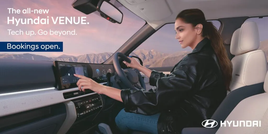 Interior dashboard view of the all-new 2025 Hyundai Venue showcasing the dual 12.3-inch curved panoramic displays and dual-tone Dark Navy & Dove Grey theme