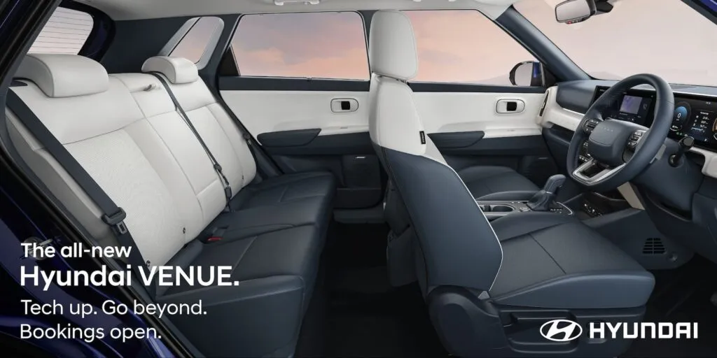 Side view of the all-new 2025 Hyundai Venue interior showing seats and door panels.