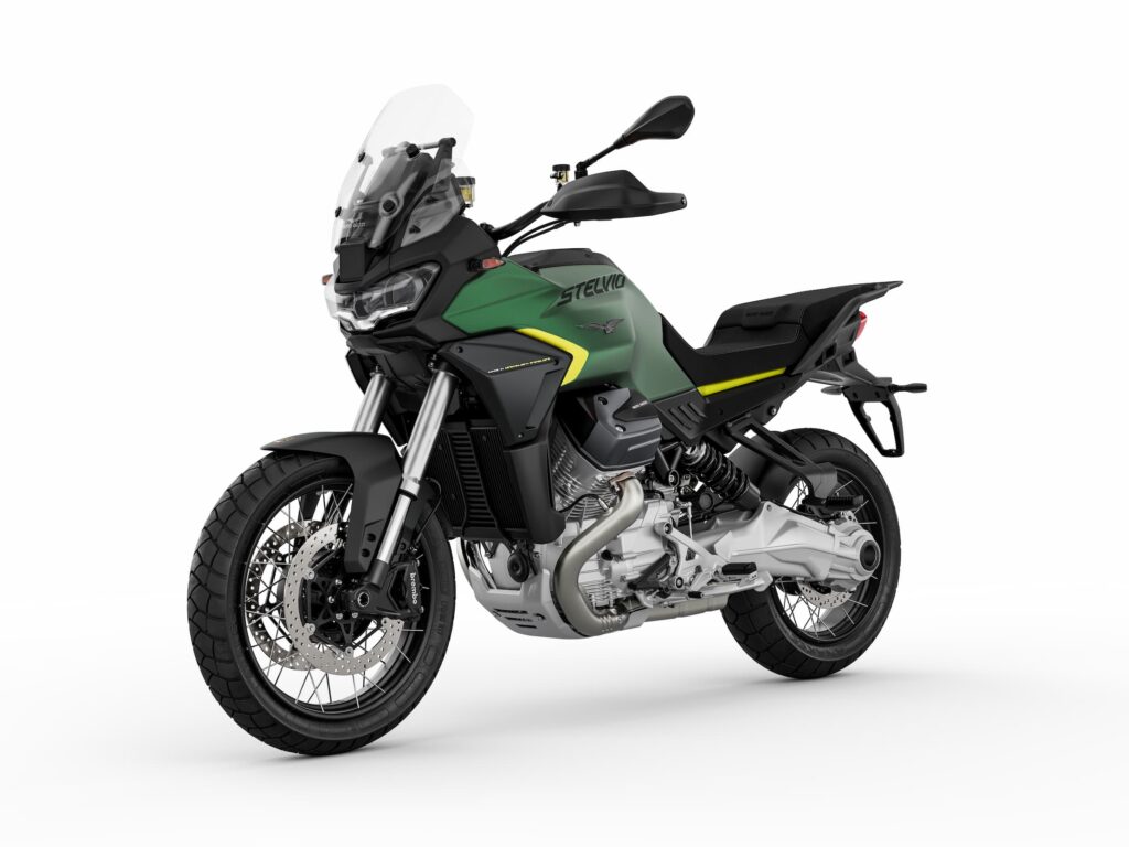 Moto Guzzi Stelvio adventure motorcycle in green and black, highlighting new graphics (Grigio Climbing or Verde Hiking) inspired by outdoor apparel.