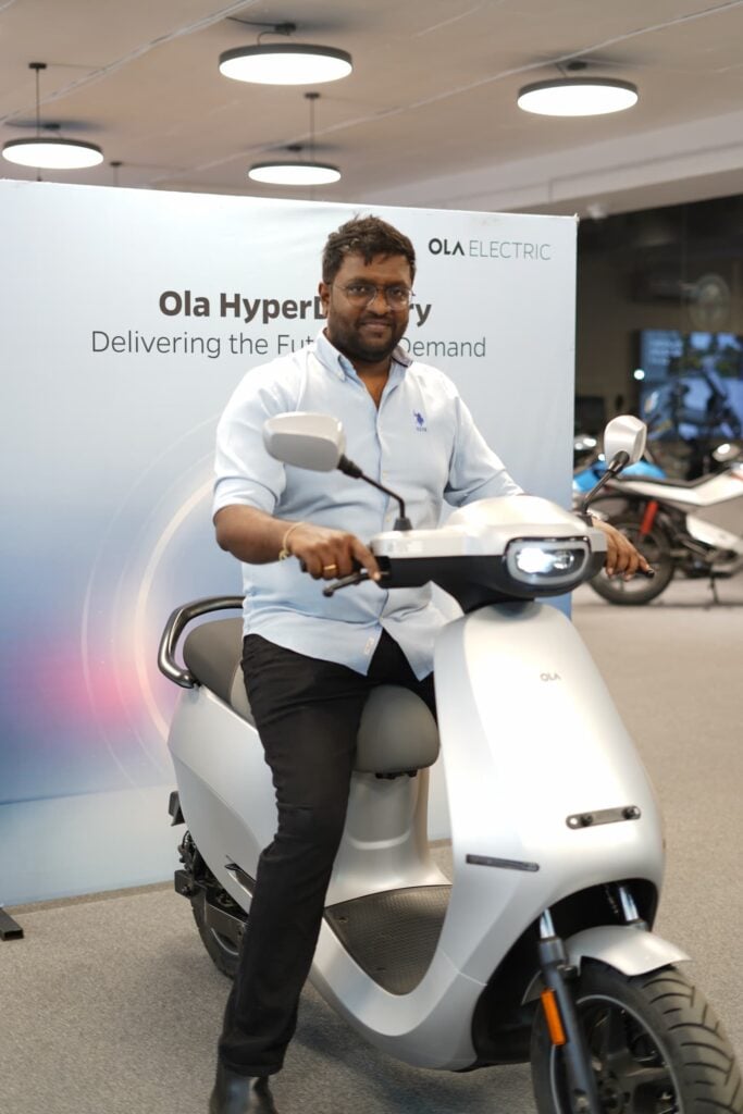 Photo of customer taking delivery of all new Ola S1 Pro+ powered by Bharat Cell via Ola HyperDelivery Service