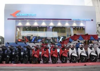 Kinetic DX and Kinetic DX+ Electric Scooters lined up in front of New Kinetic Showroom