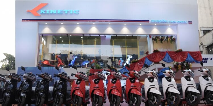Kinetic DX and Kinetic DX+ Electric Scooters lined up in front of New Kinetic Showroom