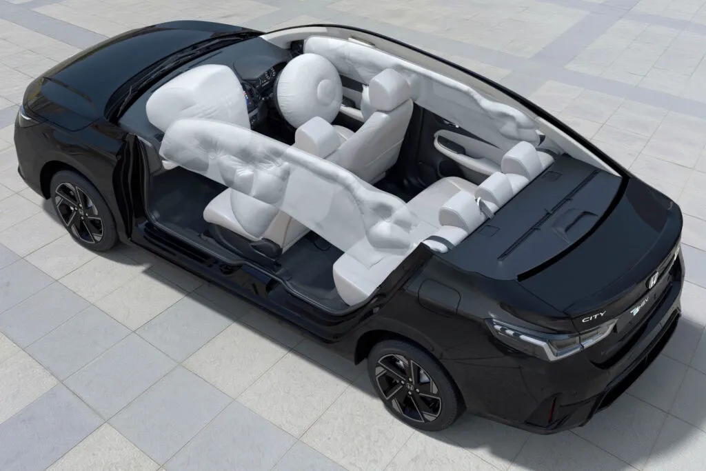 Cutaway view of a Honda City showing the deployment of front, side, and curtain airbags
